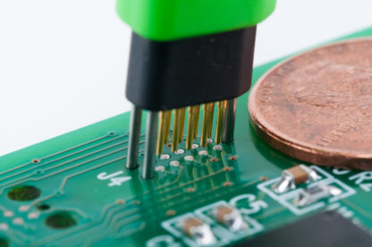 TC2050 no-legs tiny footprint plug-of-nails being inserted into PCB