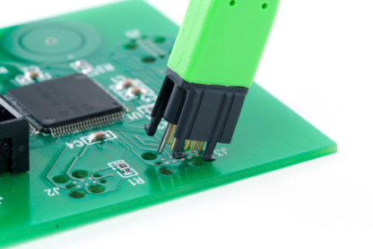 TC2050 Plug-of-Nails small footprint connector being inserted into PCB