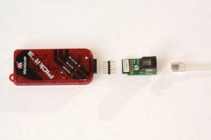 Microchip PICkit 3 with adapters lined up for Tag-connect cable