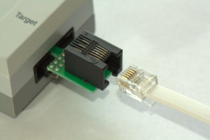Plugging TC2030-MCP cable into SPY-BI-TAG adapter