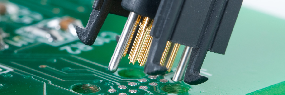Tag-Connect TC2050 plug-of-nails™ cable being inserted into PCB