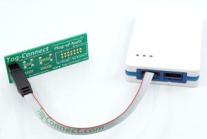 Atmel-ICE debugger programmer with programming text cable in SAM connector